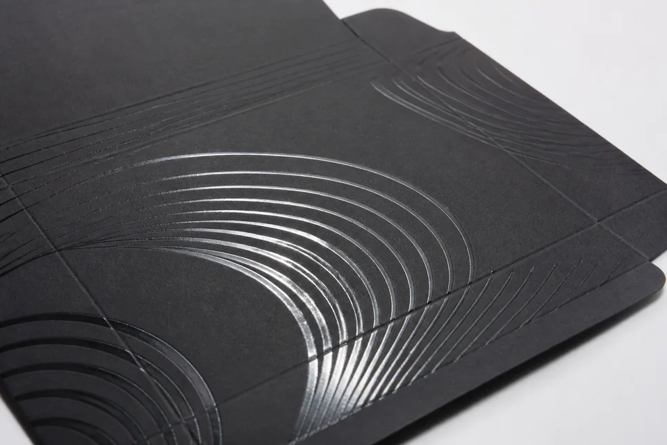 Selective spot gloss UV detail on matte paperboard