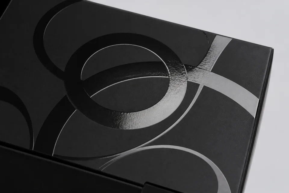 Raised spot UV gloss detail on matte packaging