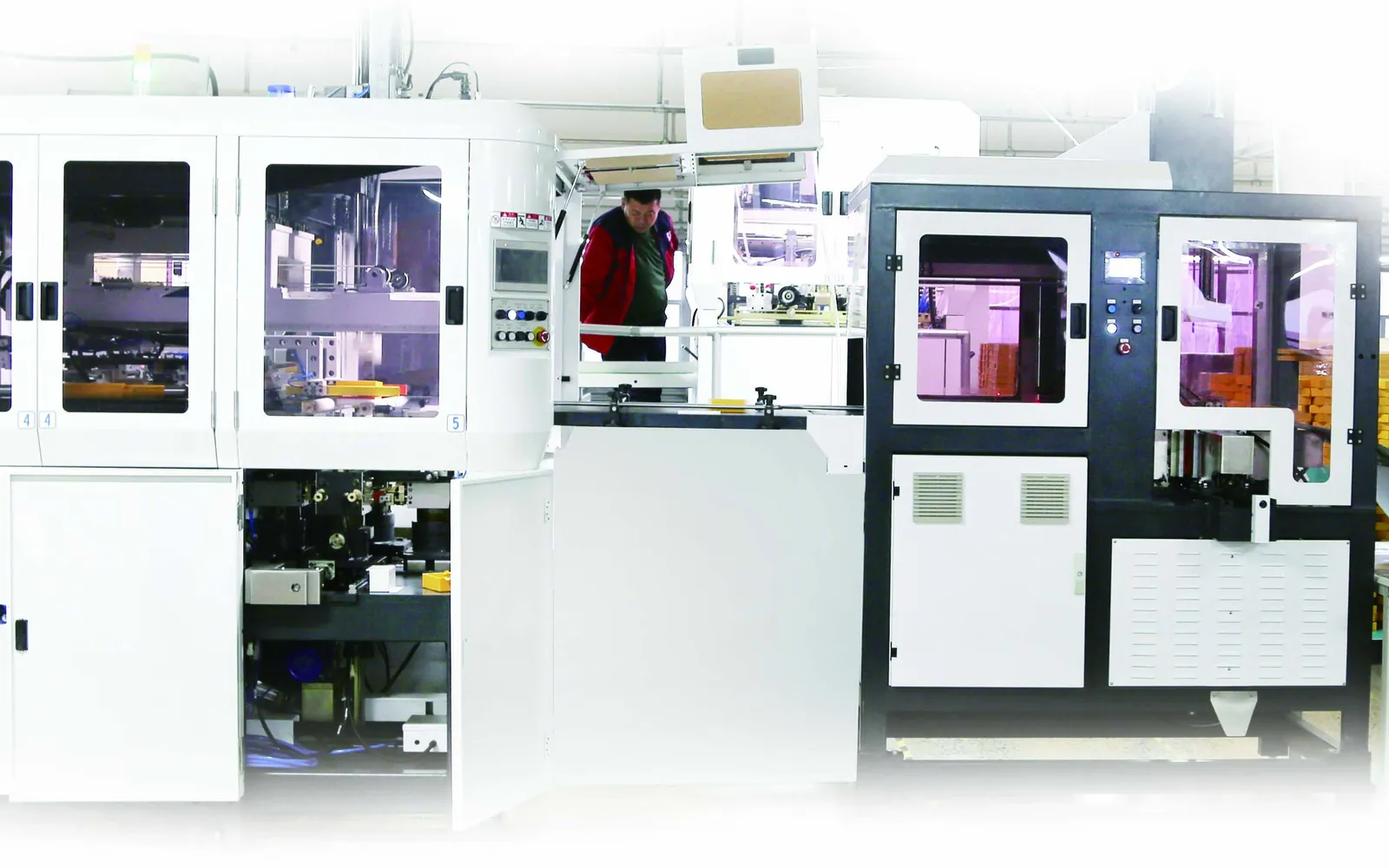 Automatic rigid gift box production line with operators at work