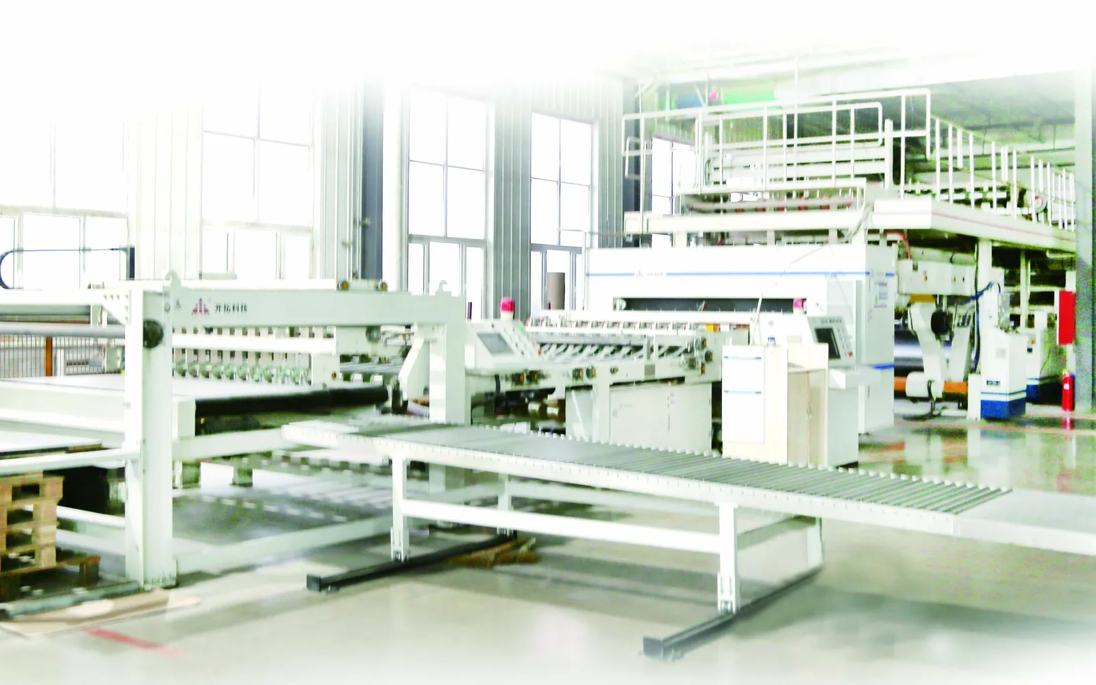 Corrugated board production line inside a packaging factory