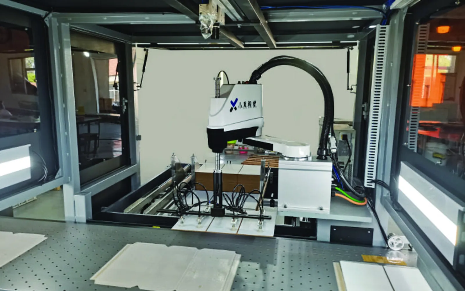 Optical positioning system used for precision rigid box assembly