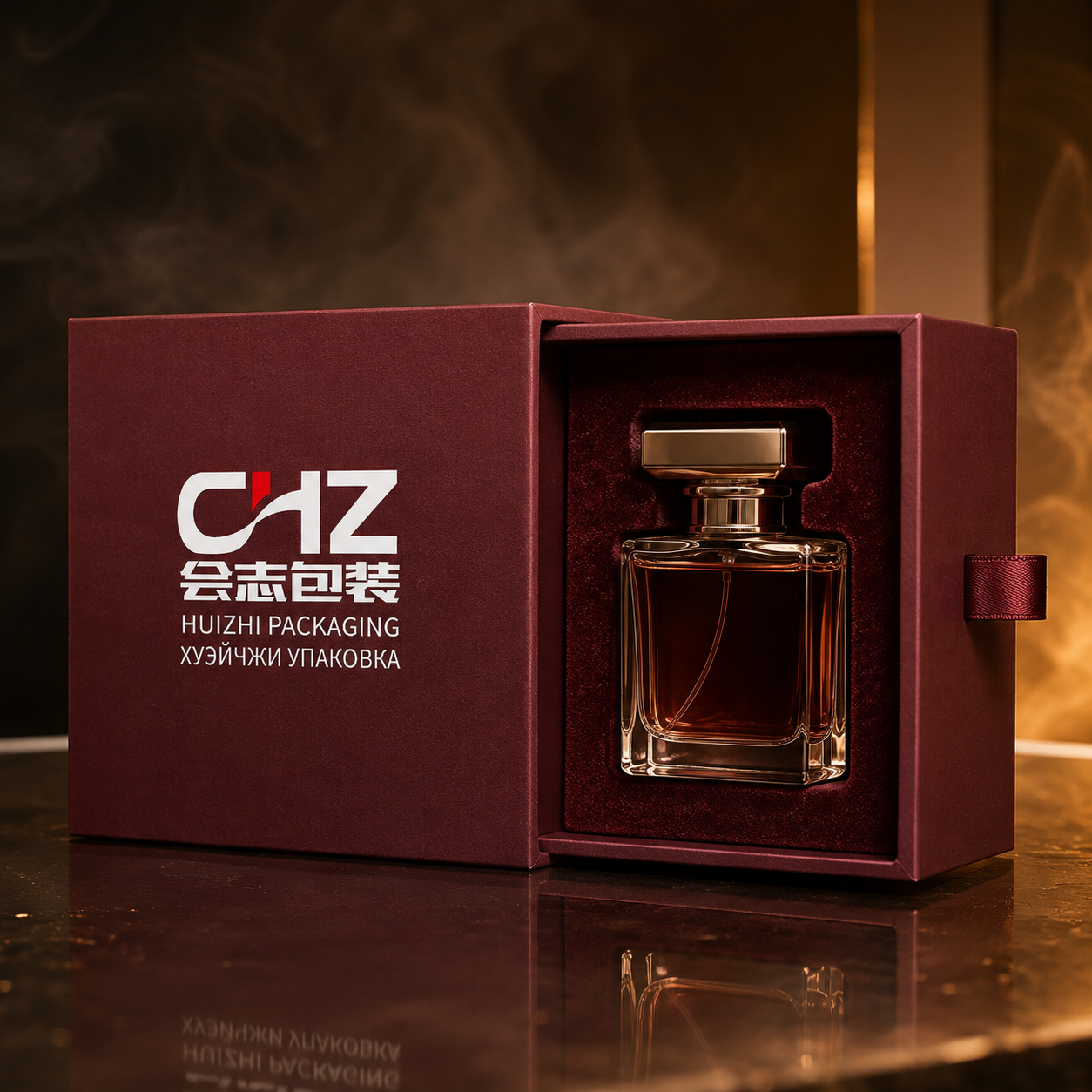Open burgundy rigid drawer box with Huizhi Packaging branding and a perfume bottle held in a fitted velvet insert.