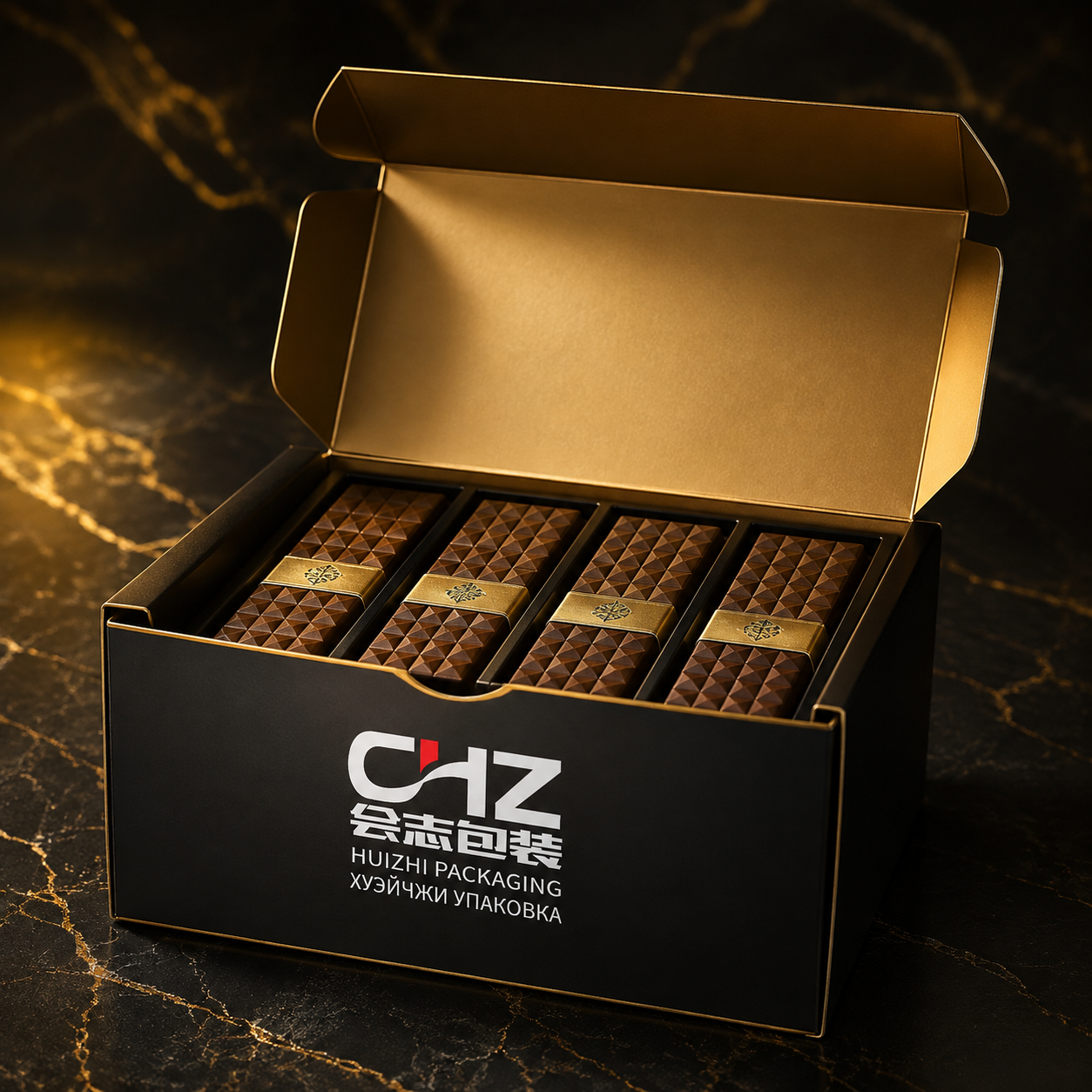 Open black and gold folding carton with Huizhi Packaging logo and four chocolate bars arranged in a divided insert.
