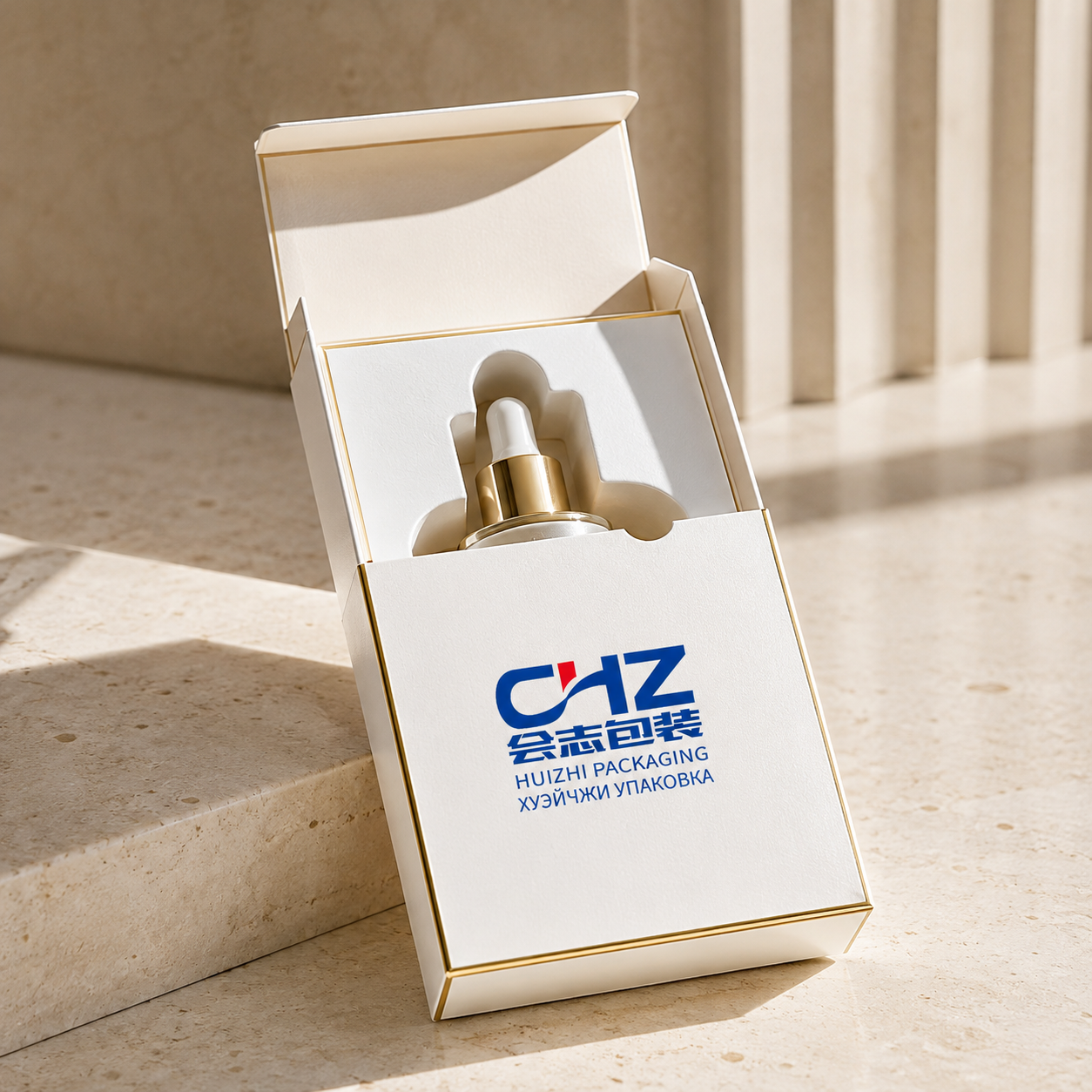 Open ivory folding carton with Huizhi Packaging logo and die-cut insert holding a cosmetic dropper bottle.