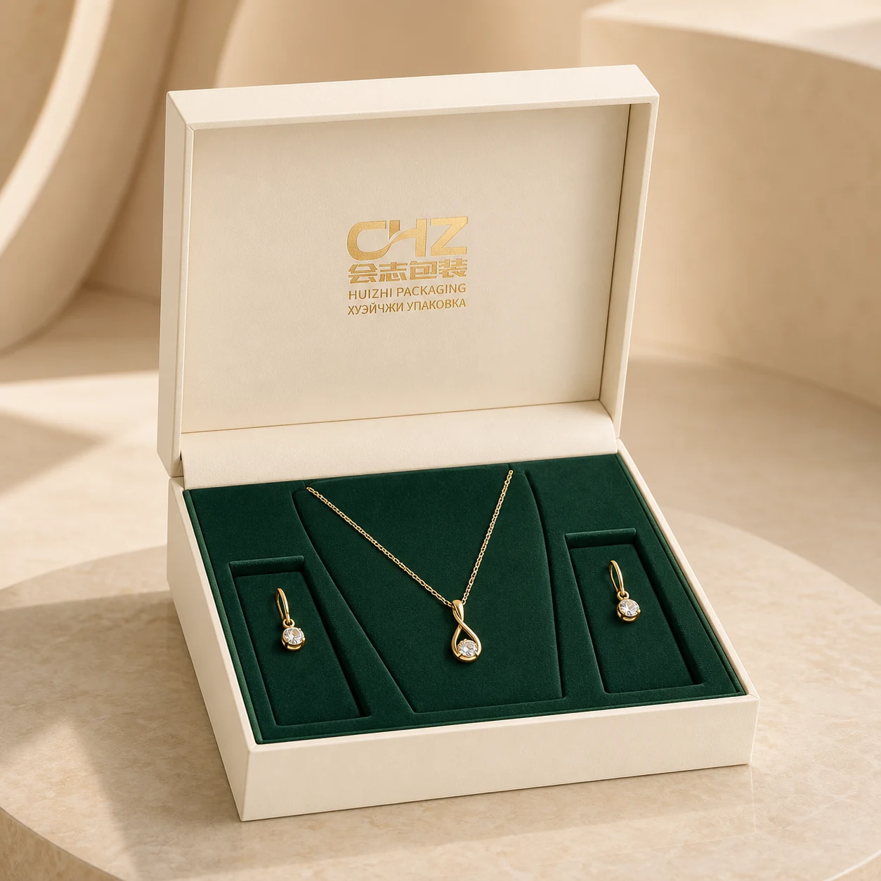 Open pearl ivory hinged jewelry box with a deep green insert presenting an unbranded necklace and matching earrings.